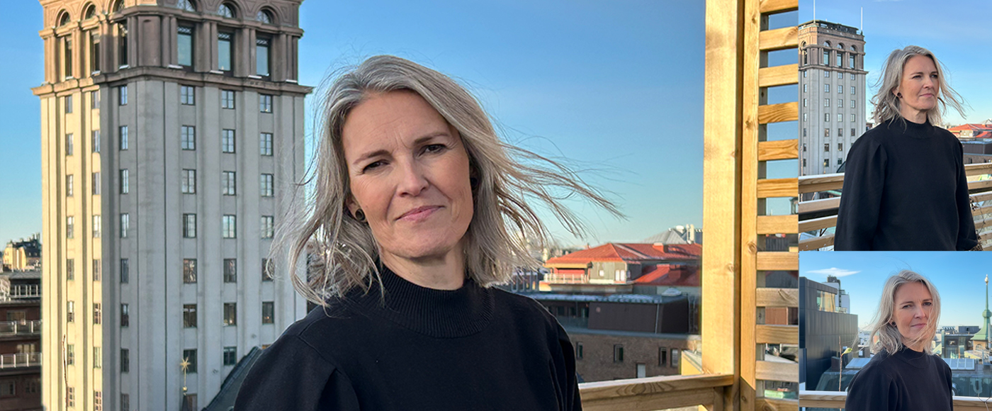 Porträttfoto av Malin Cederblad utomhus på en takterrass med takåsar och torn i bakgrunden.